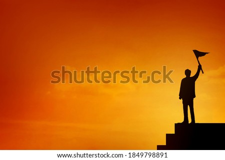 Businessman with flag stand on the  top of stairs , Business Success and Leadership Concept