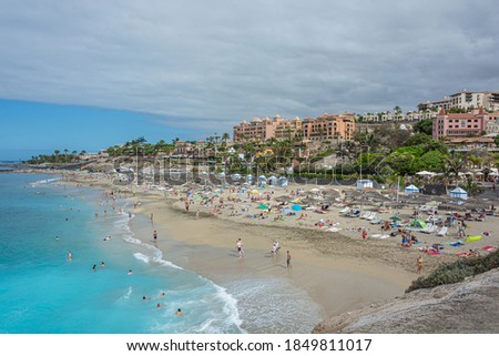 Ocean sand Beach Del Duque (Tenerife, Spain). Stock photo.
