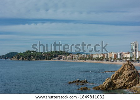 Seascape. The beach and coastline of the resort of Lloret De Mar (Spain). Stock photo