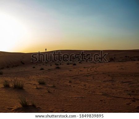 Picture of a boy in the desert. Outdoors