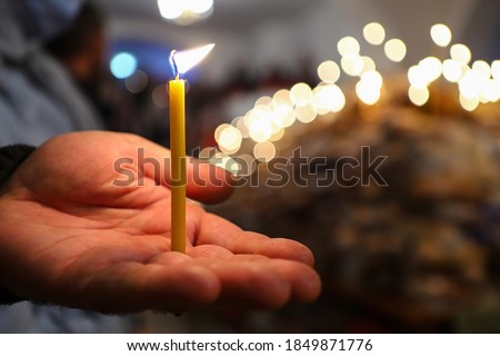 Funeral liturgy with prayer for the dead. Crucifixion, bread and candles in the Orthodox Church. The concept of Orthodoxy. Royalty-Free Stock Photo #1849871776
