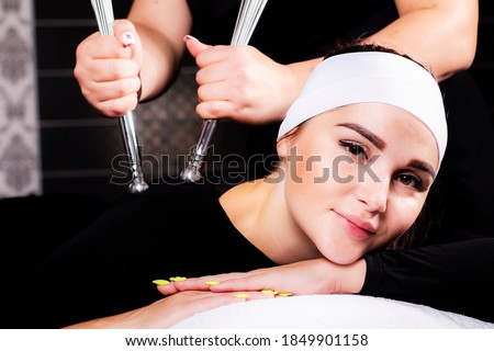Wellness back massage. Photo of a young woman on a massage procedure.