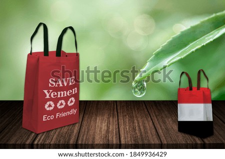Save Yemen, eco friendly green bag on table, non woven fabric bag, future of Pakistan, Use ECO Bag