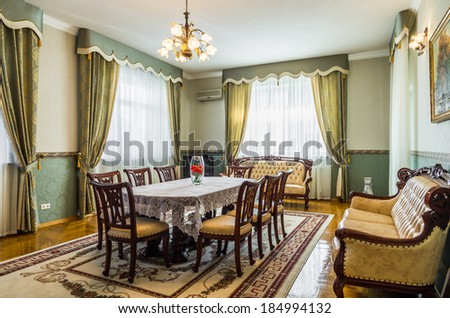  Dining room classicism interior with carpet and painting