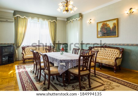  Dining room classicism interior with carpet and painting