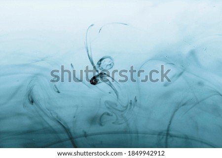 Ink patterns in water, abstraction background