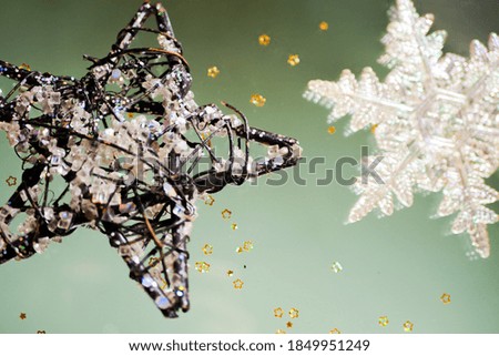 Toy snowflake levitate. Glitter golden stars. New Year flat lay