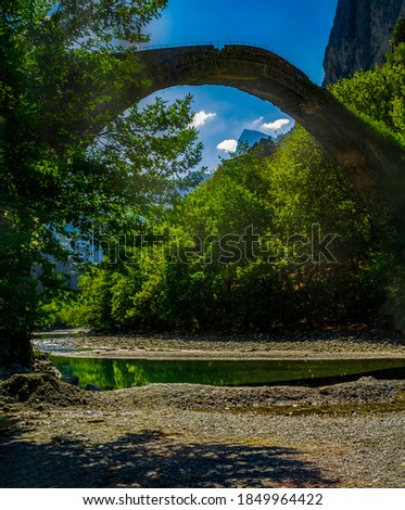 Impressive view of the famous stone bridge of Aoos river located in Konitsa, Epirus, Greece.