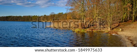 Panoramic view to the winterly banls of river Dahme in Berlin-Koepenick - panorama from 7 pictures