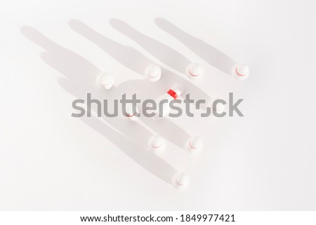 white bowling pins on a white background.Business concept