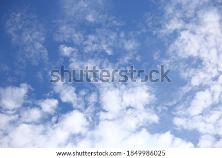 Summer blue sky with white clouds, background, copy space.