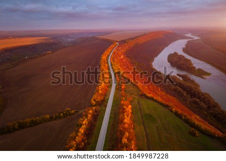 Beautiful top view of winding river in sunset. Scenic image of drone photography. Location place Dnister or Dniestr canyon, Ukraine, Europe. Picturesque wallpaper. Discover the beauty of earth.