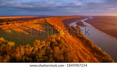 Beautiful top view of river in sunset. Drone photography. Location place Dnister or Dniestr canyon, Ukraine, Europe. Art photo of nature. Scenic image of exotic place. Discover the beauty of earth.
