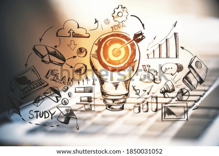 Laptop computer with drawing charts and target lightbulb. Trade and financial growth concept. Multiexposure