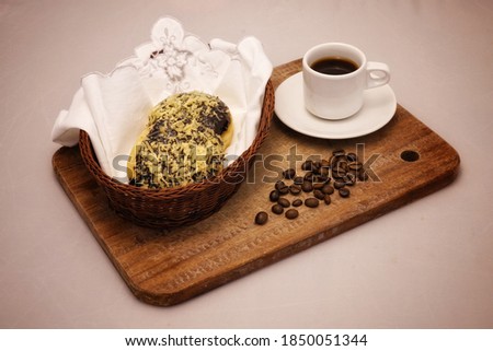 selective focus of breakfast tray of coffee and doughnuts in basket