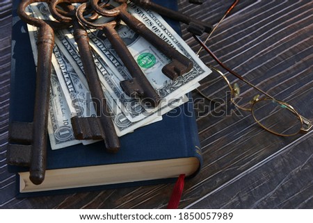 Dollars paper money and keys of investment 