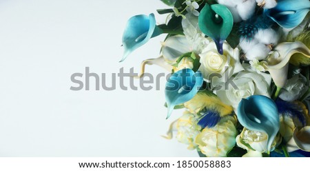 Blue Calla lilies on a white background.
St. Valentine's Day. Beautiful  flowers            