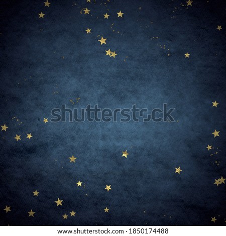 Christmas confetti, golden glitter texture on a dark background.