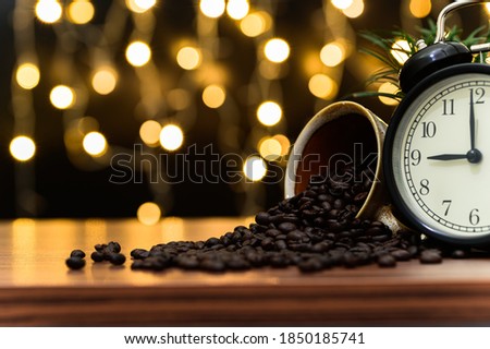 Coffee beans Placed on the desk Orange bokeh floor scene