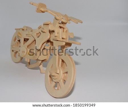 
bike made of wooden puzzle pieces