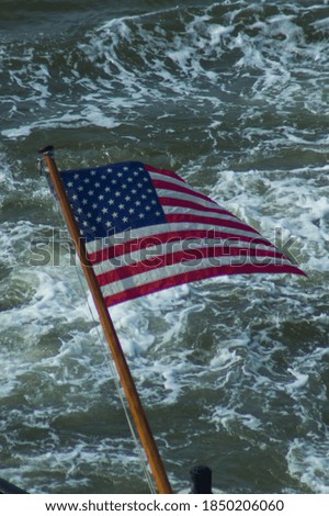 A Flag of the United States waving in the wind