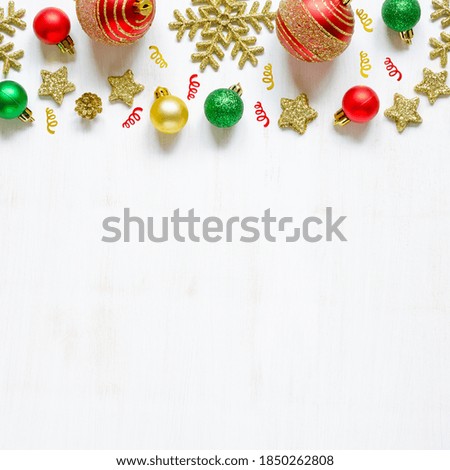 Festive Christmas accessories on white wooden background. Frame. Copy space composition. Overhead shots.