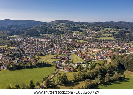 Picture of an aerial view of the community Frauenau in the Bavarian forest with landscape and mountains in the background, Germany