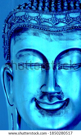 buddha on wooden board in blue