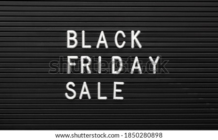 Black Friday sale white text lettering on black background of Letter Board. Black and white letters message promotion banner. Top view