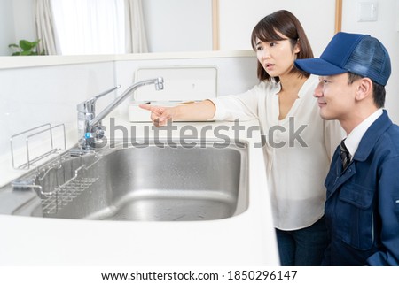 Portrait of a water supplier and a woman
