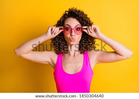 Close-up portrait of her she nice attractive flirty lovable hot wavy-haired girl touching specs love lover sending air kiss romantic isolated on bright vivid shine vibrant yellow color background