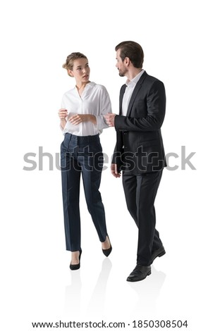 Isolated portrait of businesswoman and businessman walking together and talking. Concept of communication