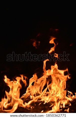 close up pictures of fire and flames in the dark.