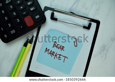 Bear Market write on sticky note isolated on Wooden Table. Business concept. Selective focus on Bear Market text
