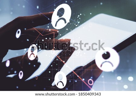 Social network media concept with finger presses on a digital tablet on background. Double exposure
