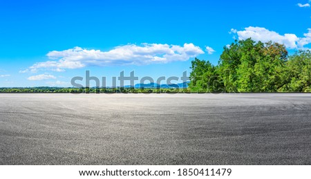 Empty racing track road and green forest with mountain landscape in the suburbs of Beijing.
