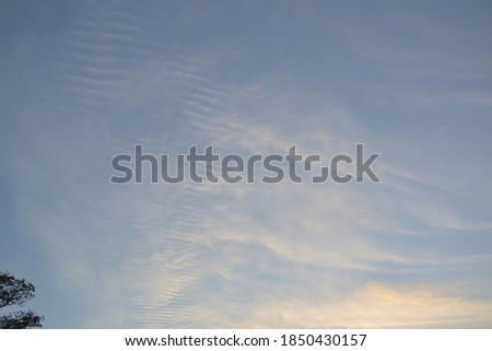 
blue sky with blurry clouds