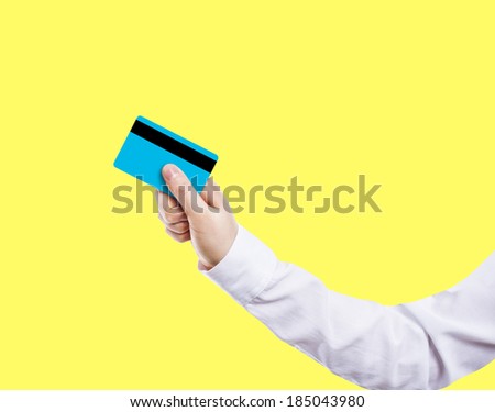 Businesswoman holding credit card, side view