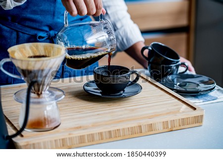 Man making coffee in the kitchen.
Delicious coffee image.