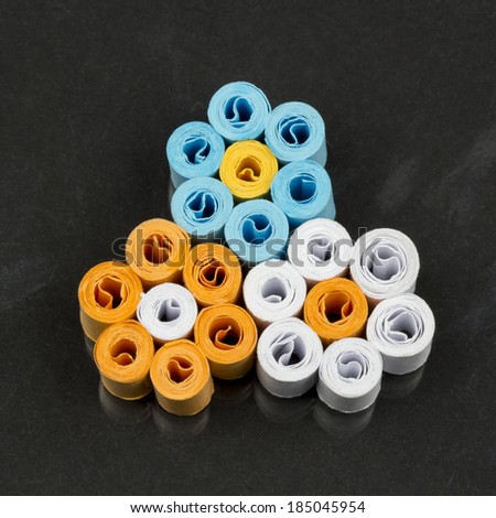 Paper flowers with quilling technique on dark background