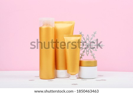 Winter care cosmetics on a colored background top view. set of cosmetics for winter care
