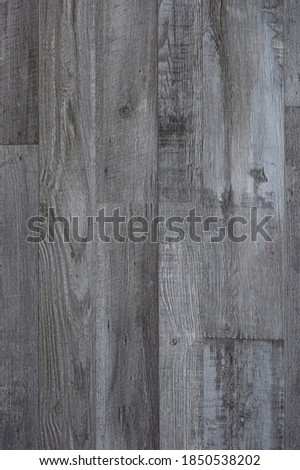 Hardwood floor viewed from above for natural texture and background. Laminate flooring. Marble surface.