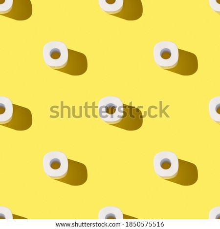 Creative seamless pattern made of toilet paper rolls for trendy yellow coronavirus background
