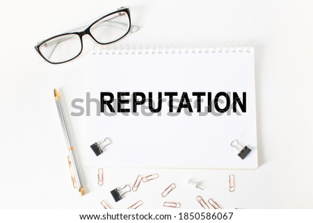 text REPUTATION in a magnifying glass, office concept, business concept, Finance