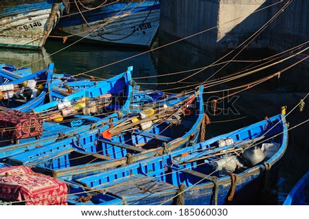 Blue boats for shark fishing in the Essaouira port at the morning. Morocco, the Atlantic coast, North Africa.