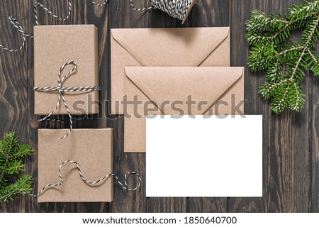 Christmas gift boxes letter paper gift boxes on wooden background