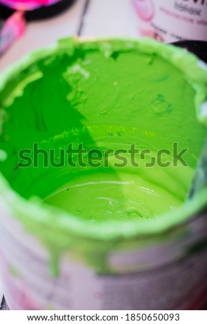 closeup of paintbrush cans or pots with paint in beautiful colors cordoba argentina