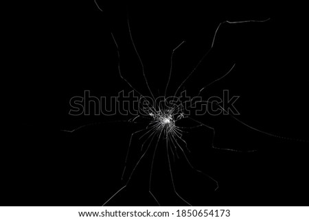 Cracks in screen. Isolated abstract black background.	