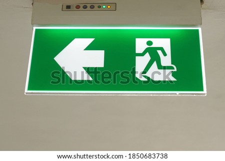 A light sign for walk and run out of the building  for security. 