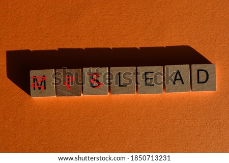 Mislead, in wooden alphabet letters, with prefix Mis crossed out, leaving the word Lead Royalty-Free Stock Photo #1850713231